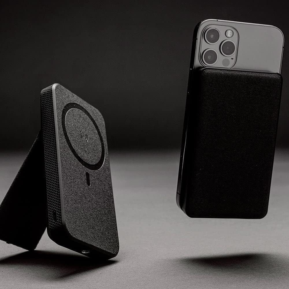 Black phone case with magnetic attachment feature on a dark background