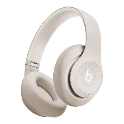 Beige Beats headphones on a white background