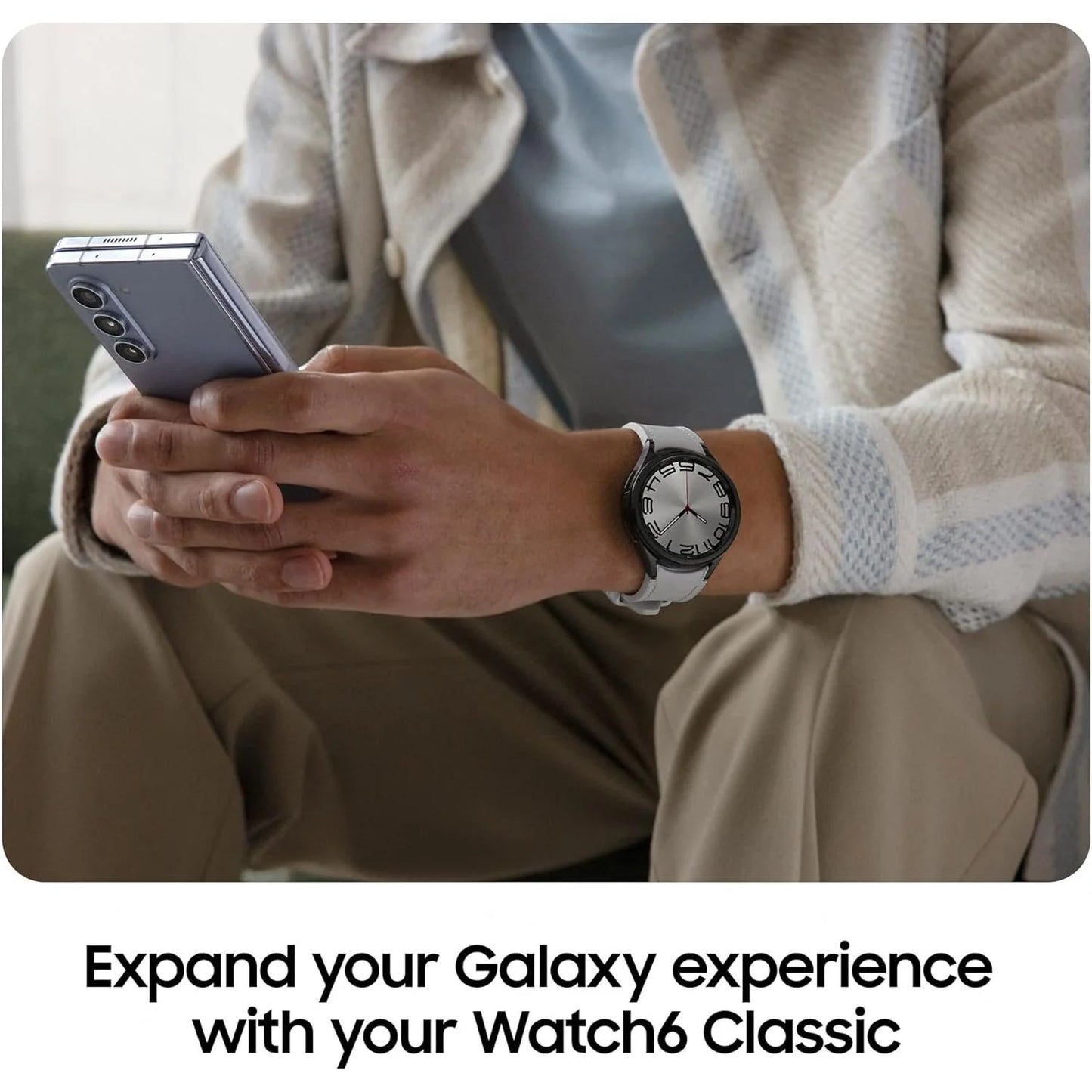 Person holding a smartphone with a watch on wrist, text 'Expand your Galaxy experience with your Watch6 Classic'.